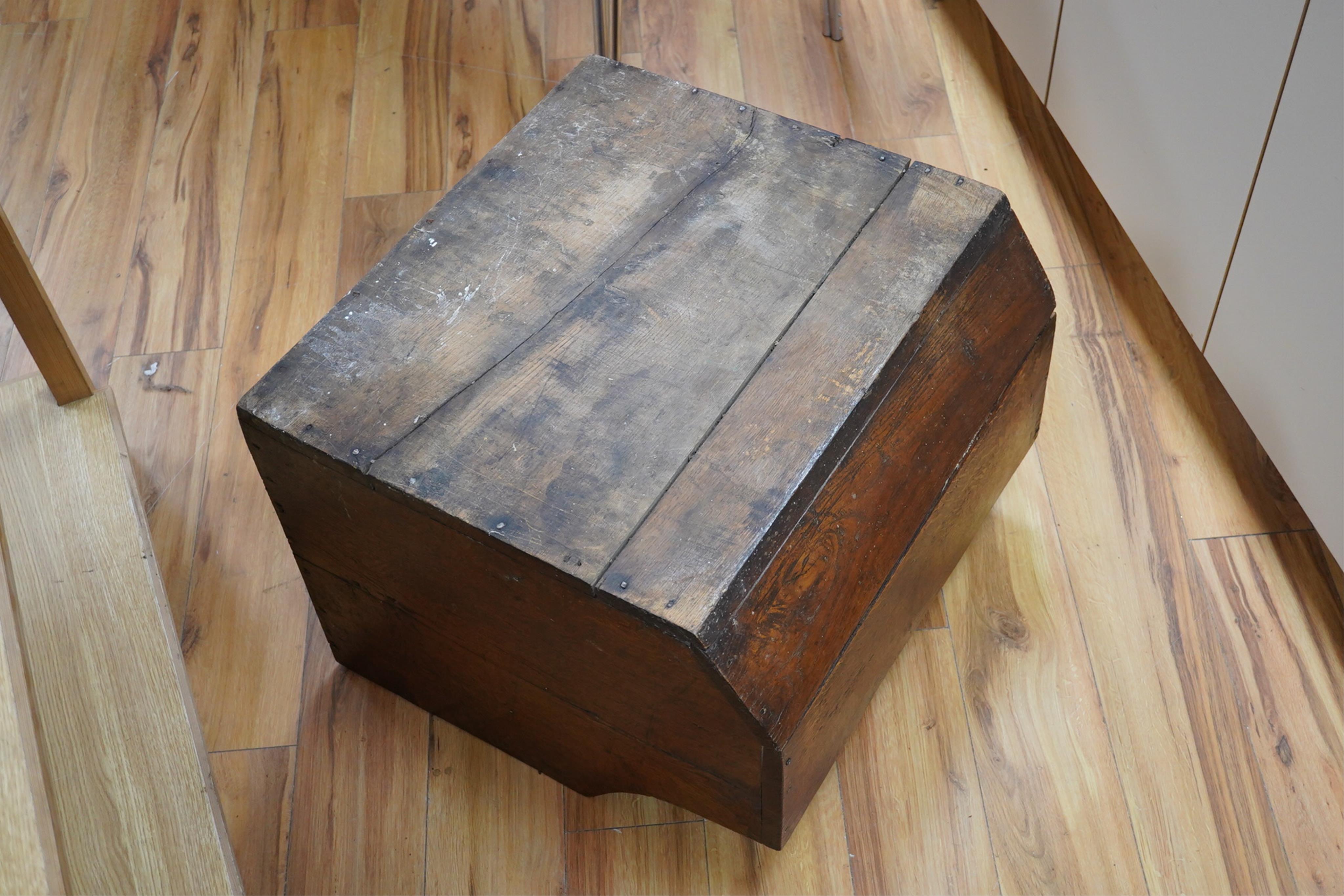 An early 20th century oak dog basket, 65cm wide. Condition - fair